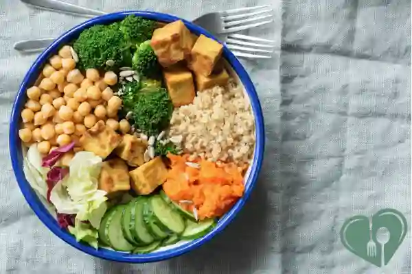 Colorful vegetarian meal bowl with tofu, quinoa, chickpeas, and vegetables