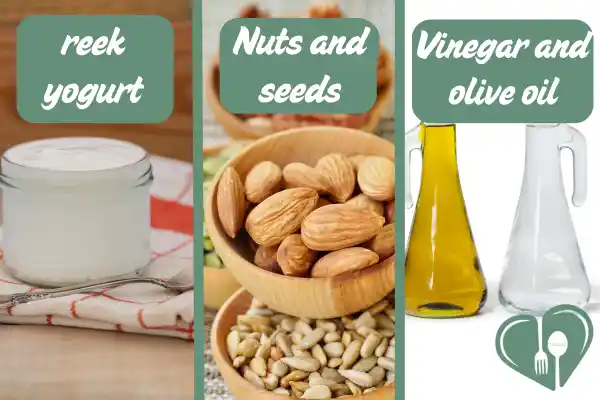 Greek yogurt, mixed nuts and seeds, and glass bottles of vinegar and olive oil arranged in a clean layout.