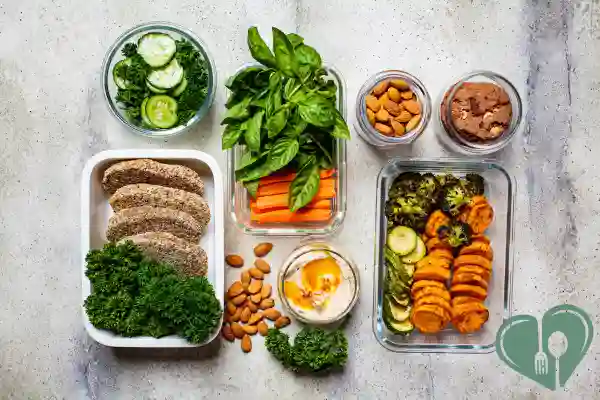 Flat lay of diabetic-friendly meal prep containers with veggies, protein, and healthy fats.