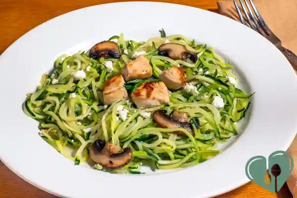 Low-carb zucchini noodles with grilled chicken, mushrooms, and feta cheese