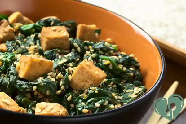 High-protein vegan diabetic breakfast with tofu, spinach, and sesame seeds