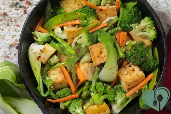 Low-carb tofu stir-fry with broccoli, carrots, and snap peas for a diabetic-friendly lunch