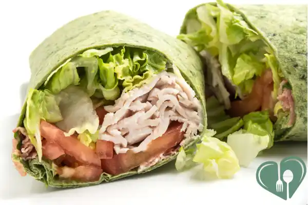 Whole-grain turkey wrap with lettuce and tomatoes for a balanced diabetic lunch