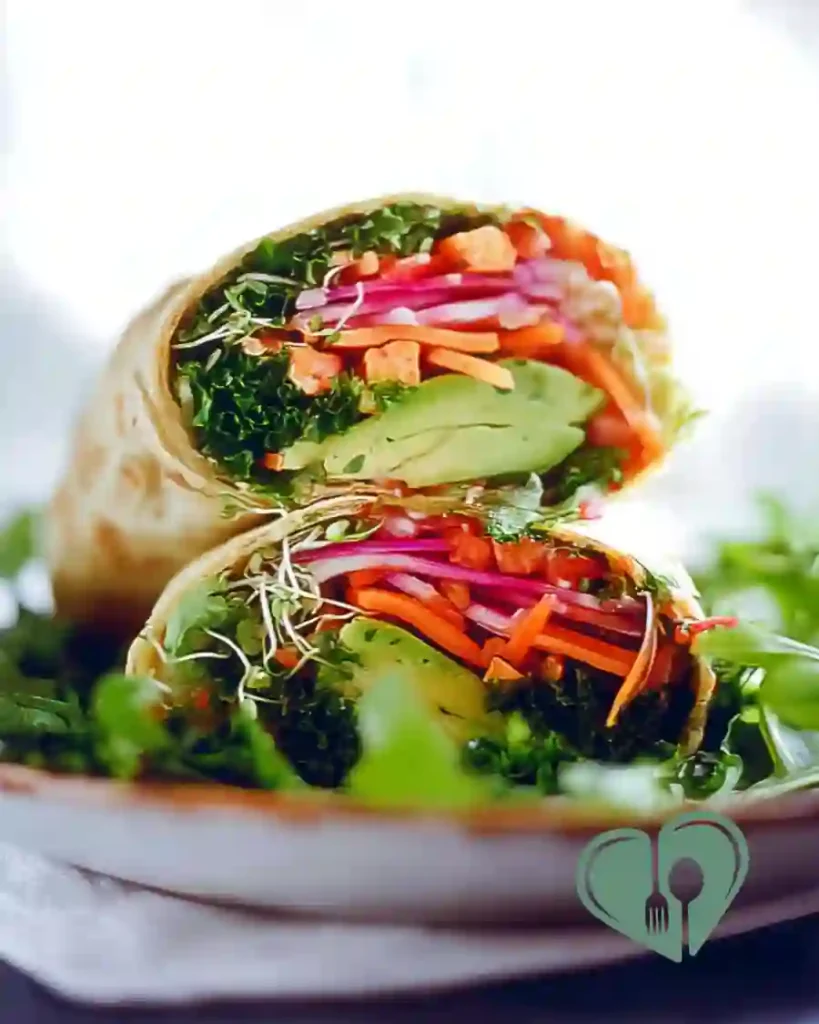 Close-up of homemade rainbow vegetable wraps with mixed fresh veggies in whole wheat tortilla